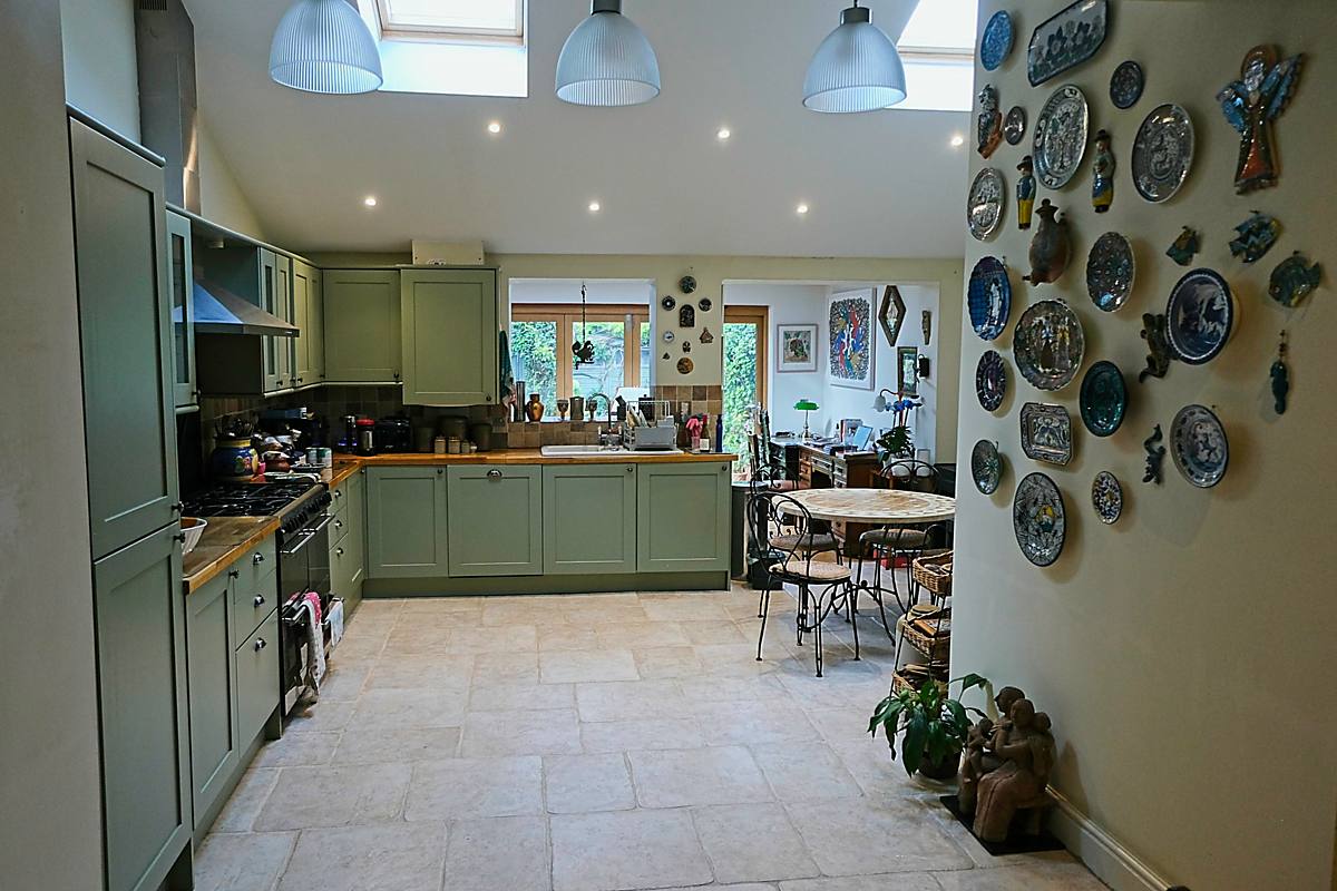 The kitchen, with painted plates hung on the wall